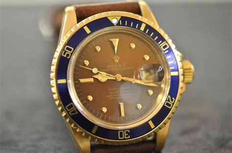 rolex submariner acciaio oro quadrante marrone